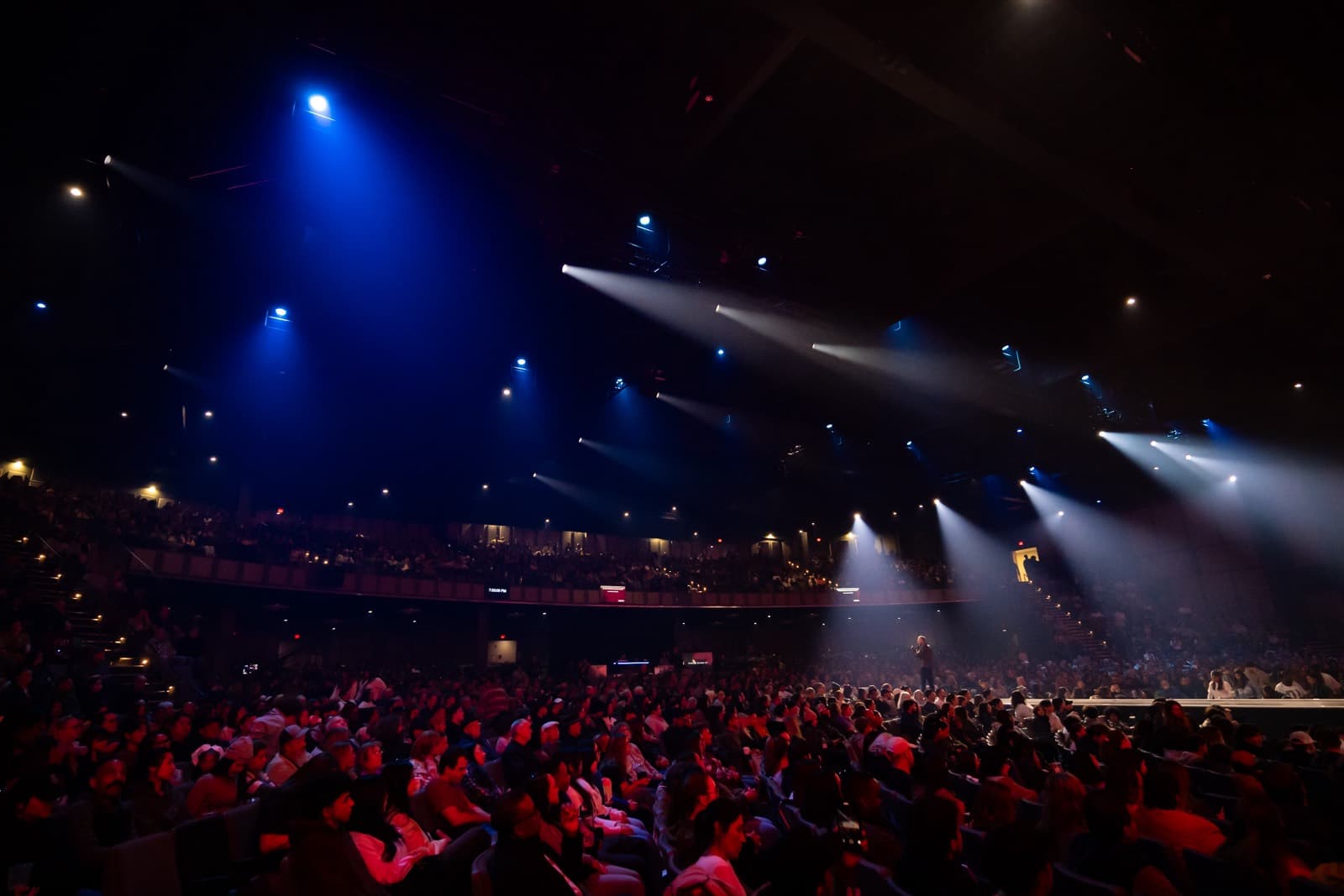 A packed arena crowd gathered for an A2X speaking event